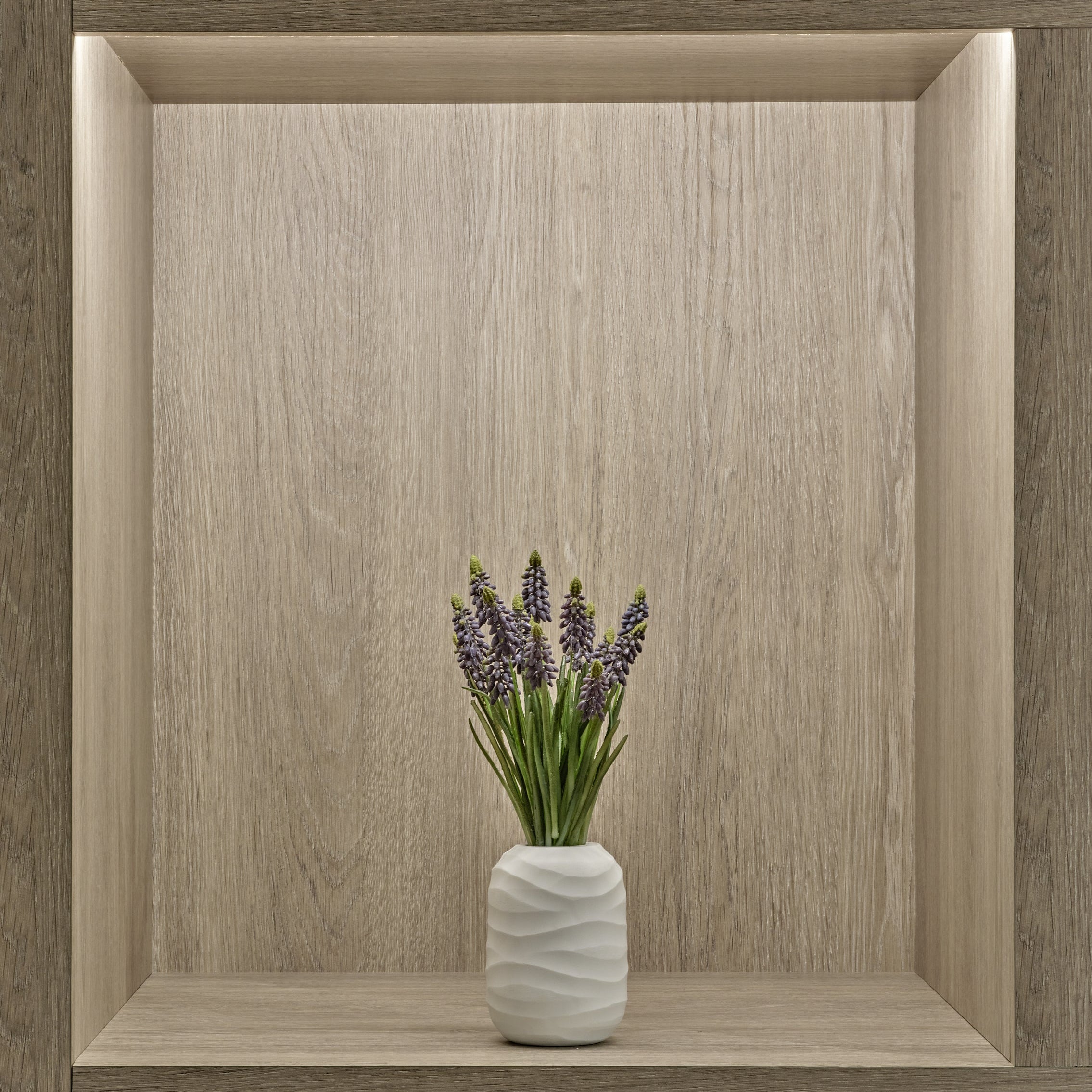 Blue Grape Hyacinth in White Vase