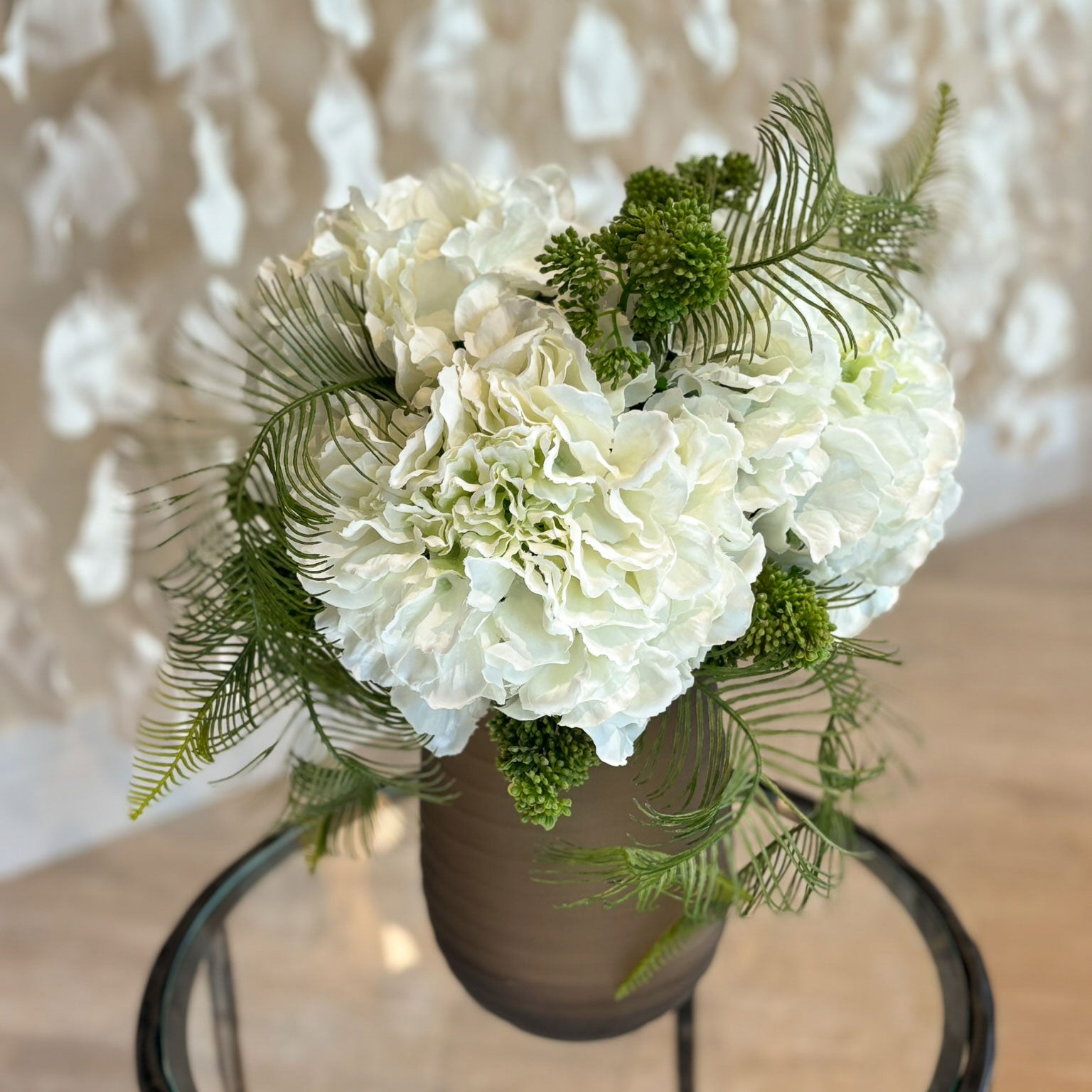 Hydrangeas, Skimmia and Fern in Dark Brown Vase